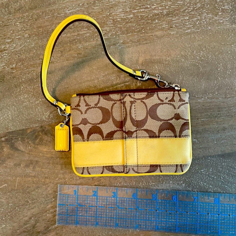Small coach tan and yellow wristlet